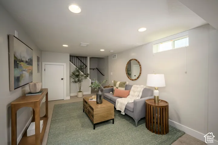 Recessed lighting, light-colored walls, and a visible window provide illumination