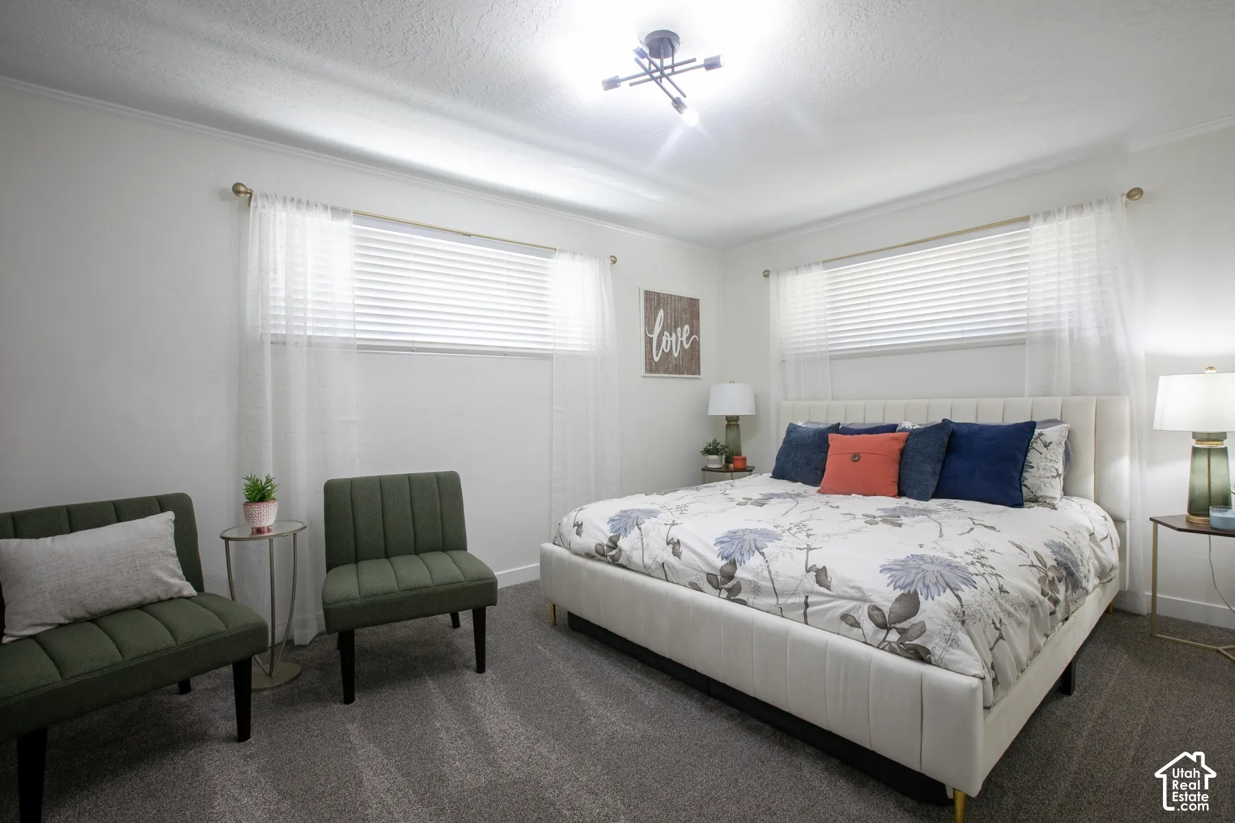 Recessed lighting, crown molding, and two windows with blinds