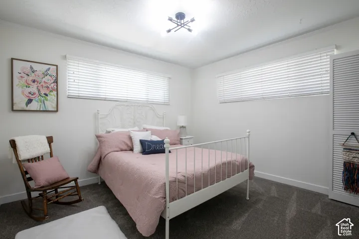 White walls with textured ceilings, featuring a contemporary ceiling light fixture