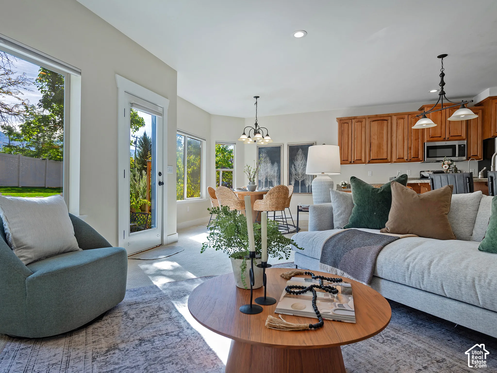 Wood-finish flooring, recessed lighting, and large windows with outdoor access