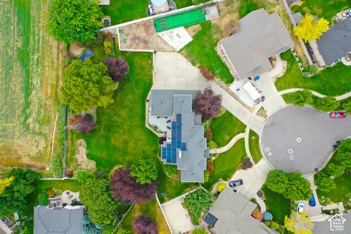 Expansive property with a cul-de-sac, mature trees, and solar panels
