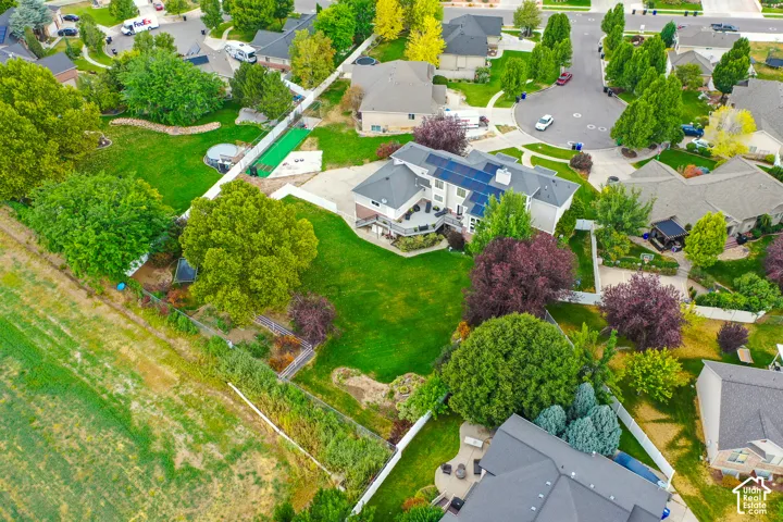 Expansive landscaped grounds with mature trees and green lawns