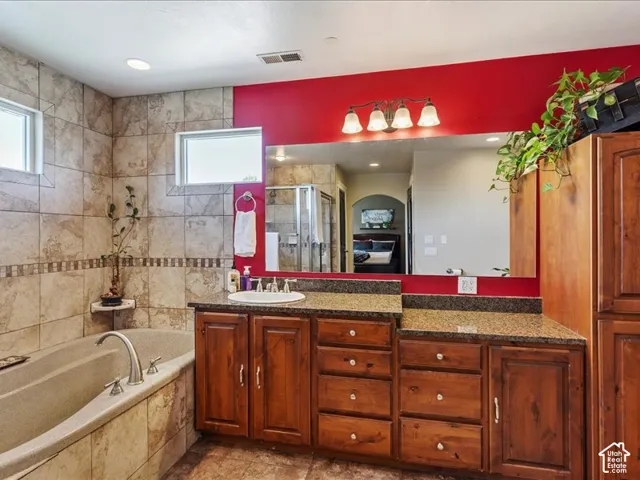 Soaking tub with brushed nickel fixtures