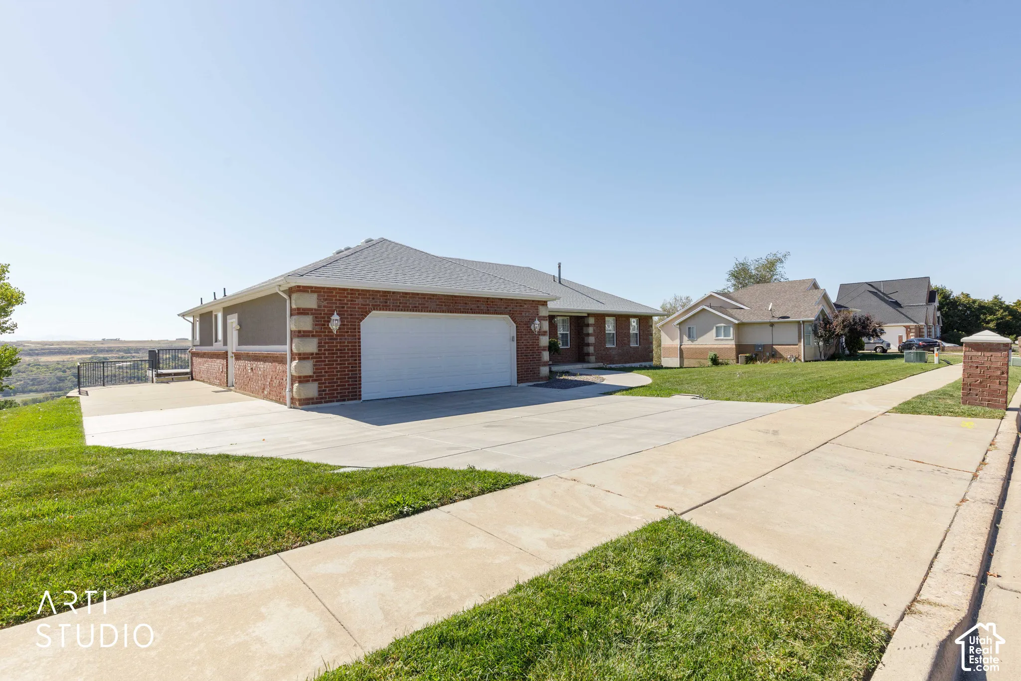 Brick and stucco exterior with a two-car garage