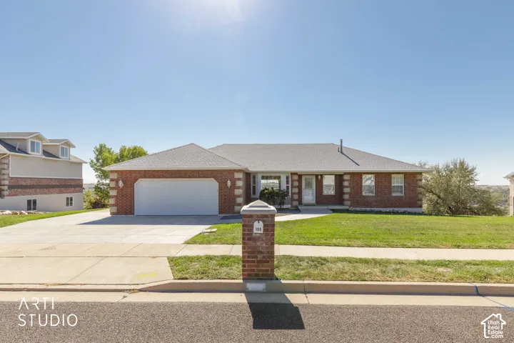 Brick exterior featuring decorative pilasters and a covered entry