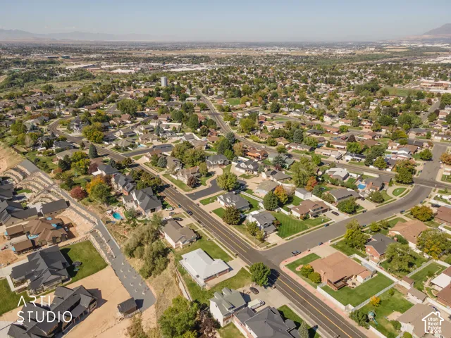 Aerial perspective showcasing a residential area with varied housing styles and mature landscaping