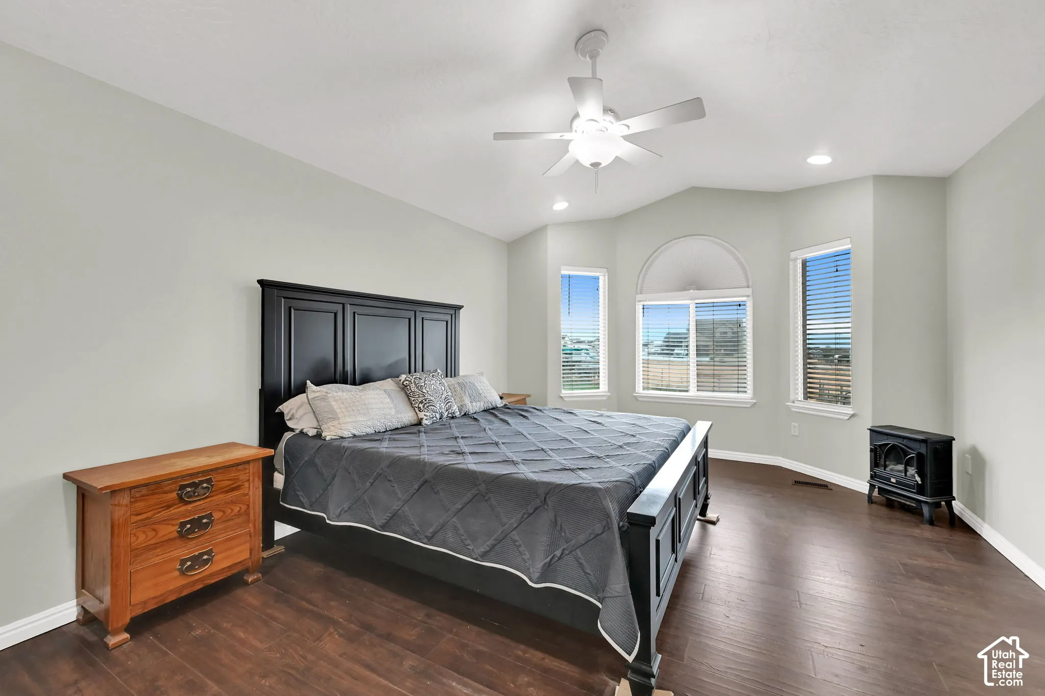 Primary bedroom with windows to the backyard.
