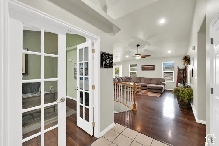 French doors opening to a large office from entry way.
