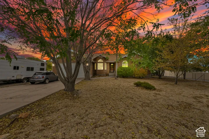 Single-story Ranch Style Home with Concrete Driveway.