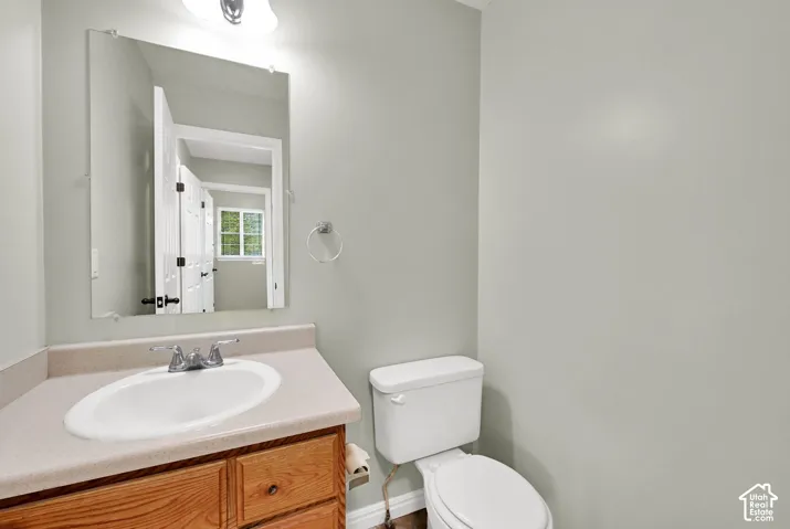 Half Bathroom off of kitchen, across from laundry room.