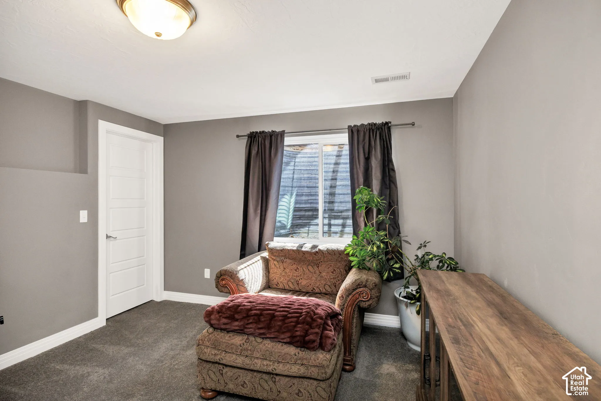Recessed window with dark drapery