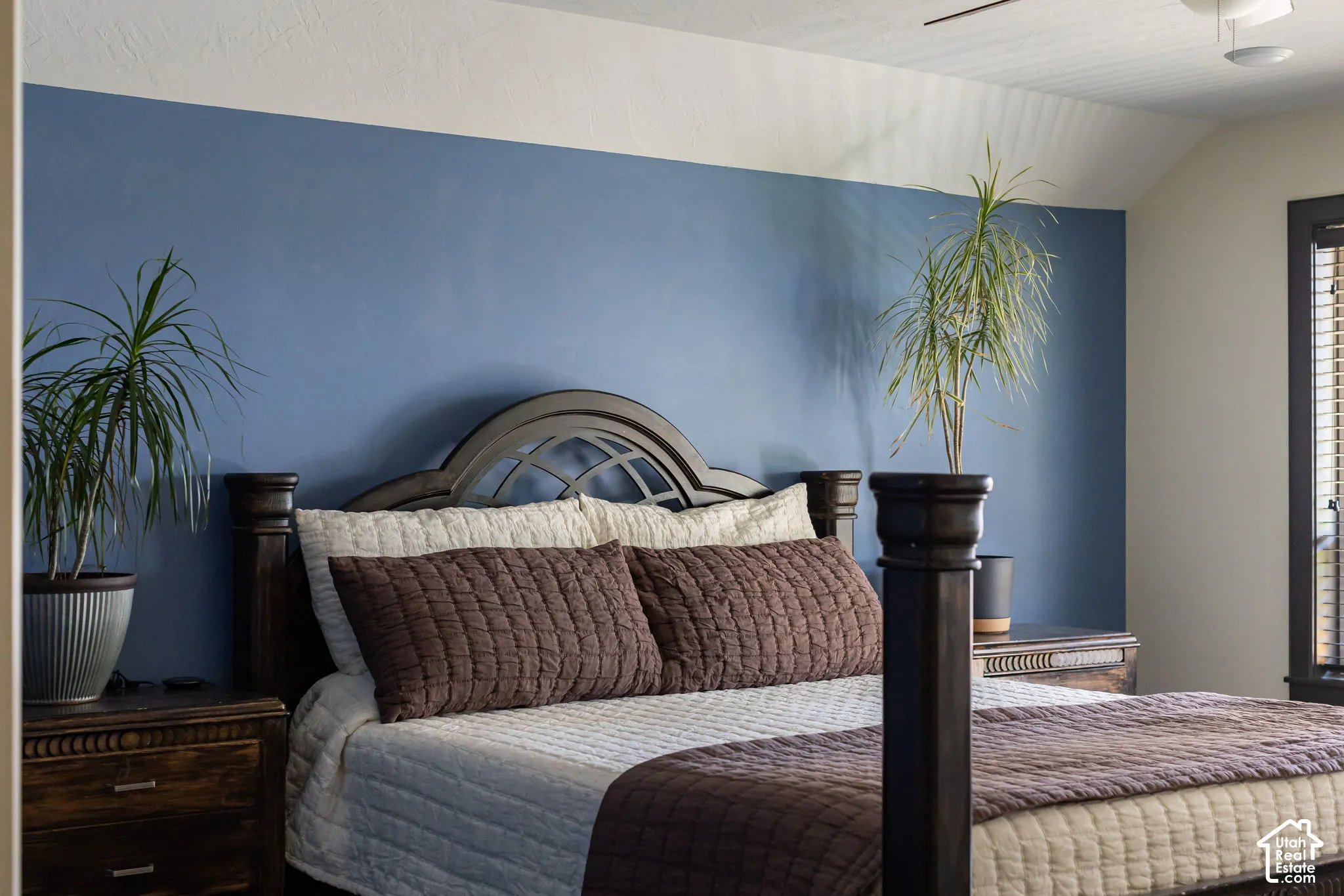 Angled ceiling lines and a painted accent wall create visual interest in this space