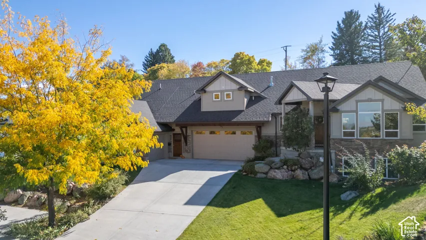 Expansive driveway leading to an attached two-car garage