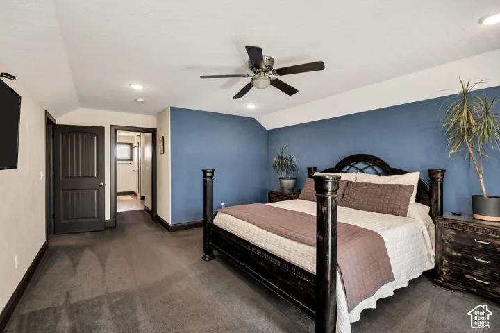 Recessed lighting, ceiling fan, dark wood-finish trim, dark wood-finish interior doors, and plush carpeting