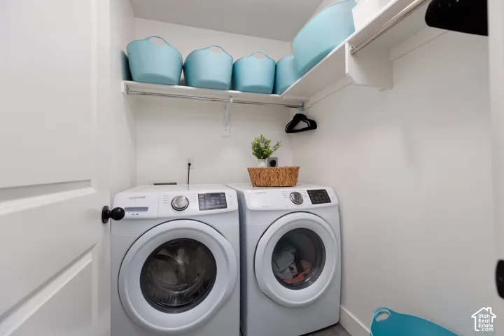 Built-in shelving unit with an integrated hanging rod, and hard-surface flooring