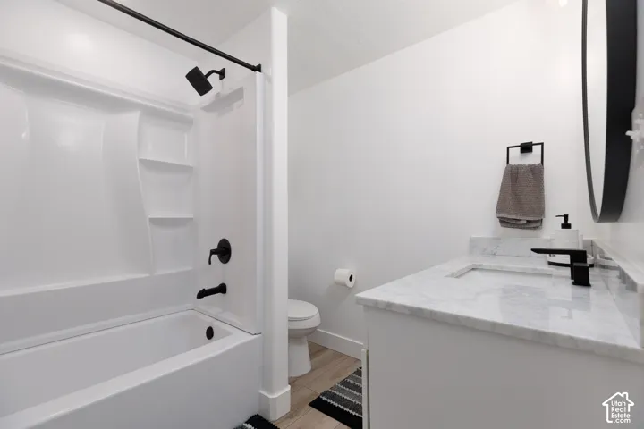 White tub/shower combination with matte black fixtures