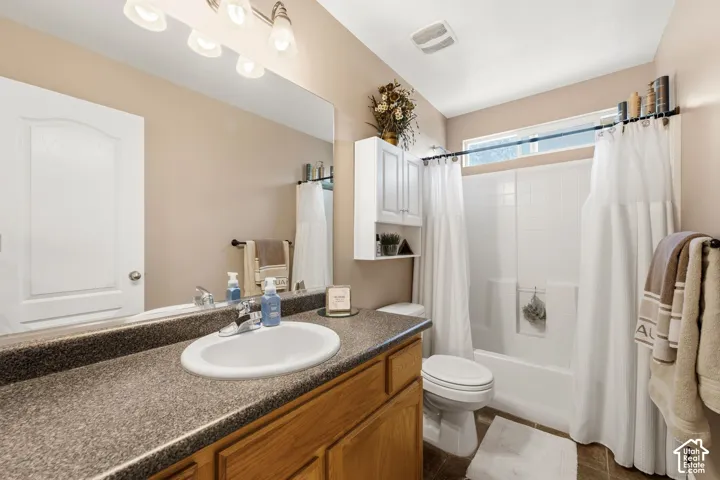 Vanity with an integrated sink and laminate countertop