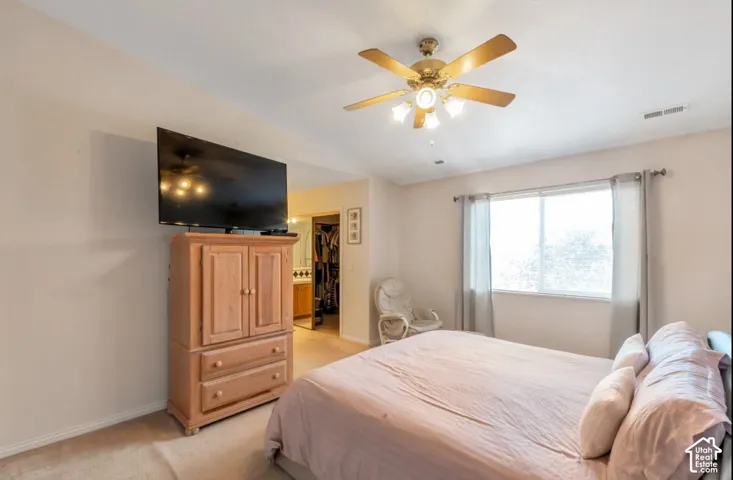 Recessed lighting, ceiling fan with light fixture, window with drapes, and carpeted flooring