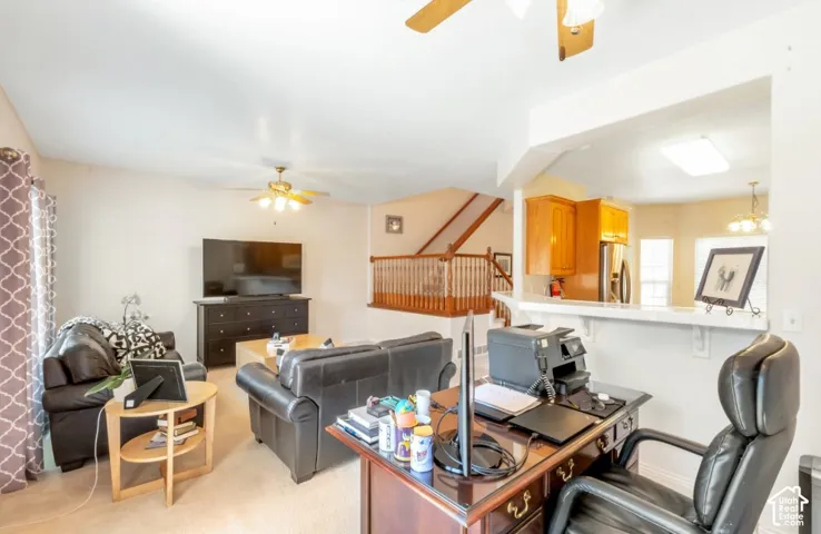 Open-concept living area with a partial wall opening to the kitchen
