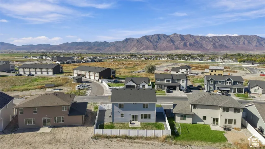 Newly constructed residential development featuring a mountain backdrop