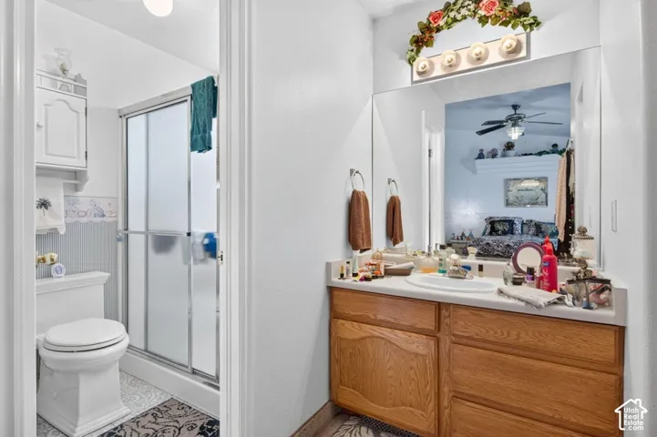 Vanity with wood-finish cabinetry and integrated sink
