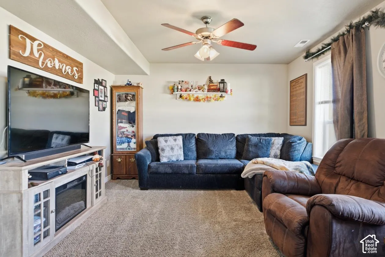 Recessed ceiling beam, ceiling fan, and carpeted flooring
