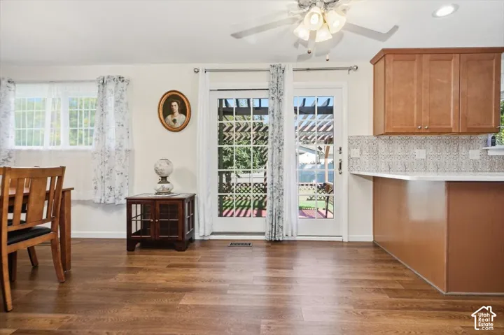Wood-finish flooring throughout, with a dual French door entry to the exterior