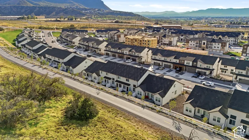 Modern residential development featuring multi-story townhomes and single-family residences