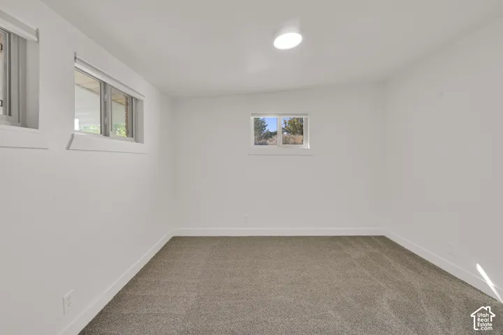 Neutral-toned carpeting with crisp white walls and trim