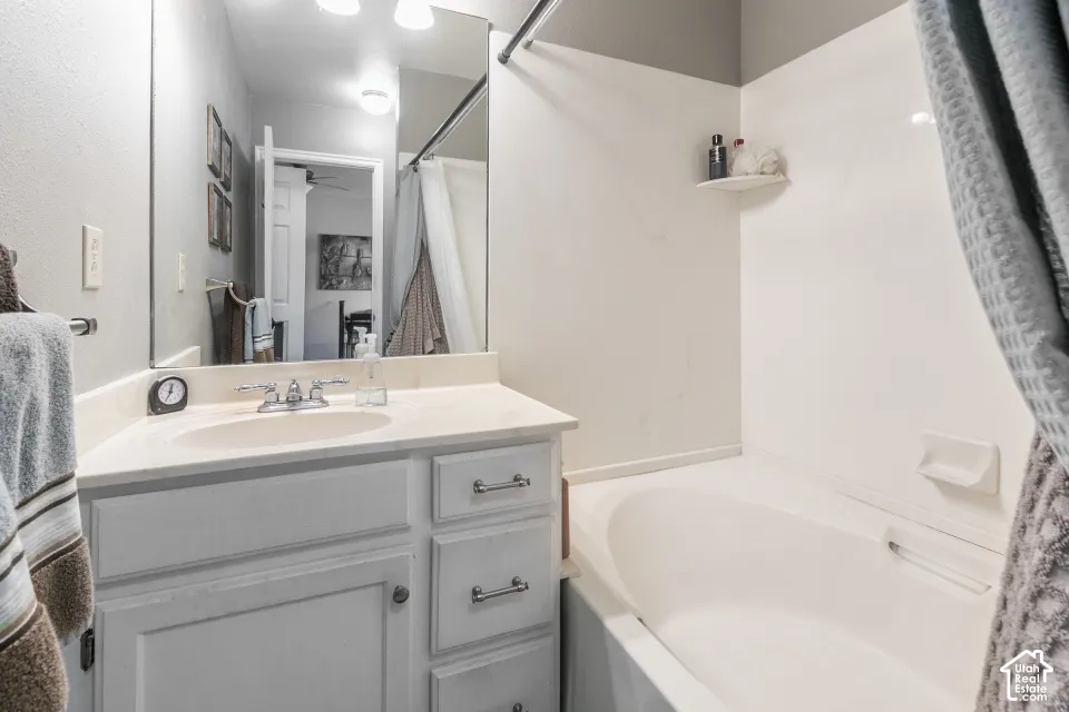 Single vanity with built-in sink, chrome faucet, and under-sink storage