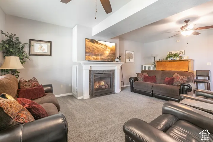 Recessed lighting, ceiling fans, and carpeted flooring