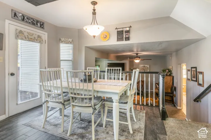 Wood-finish flooring, overhead lighting fixture, and a white interior door with glass panel