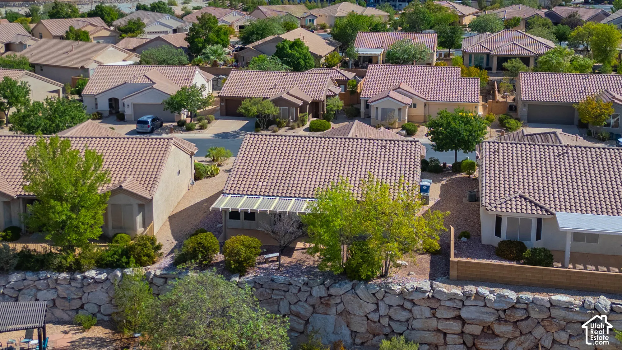 Terracotta-hued tile roofs on multiple residential structures