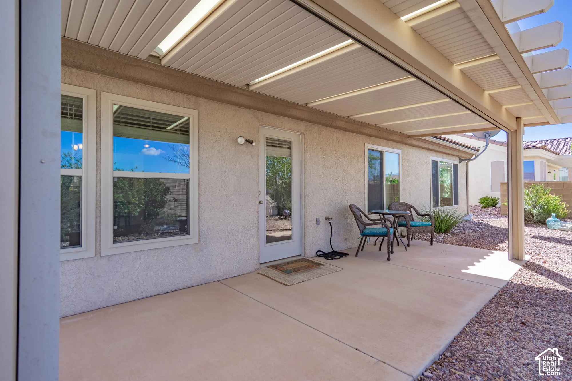 Covered patio with a solid roof extension and an additional pergola section