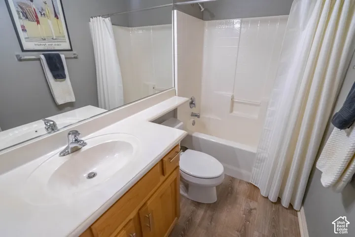 2nd Bathroom featuring a vanity with an integrated sink, chrome faucet, and wood-finish cabinetry
