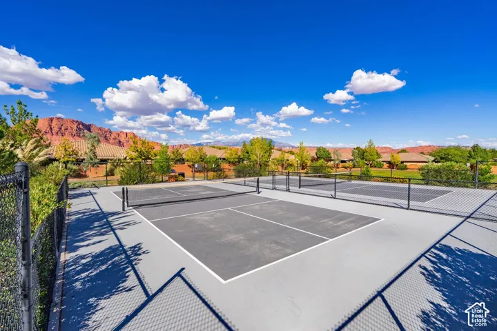 Multiple hard-surface courts with perimeter fencing