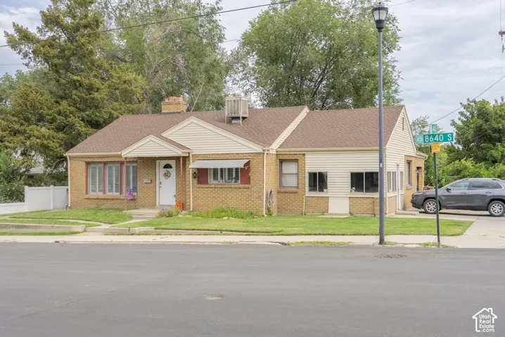 Brick and siding exterior with a shingled roof