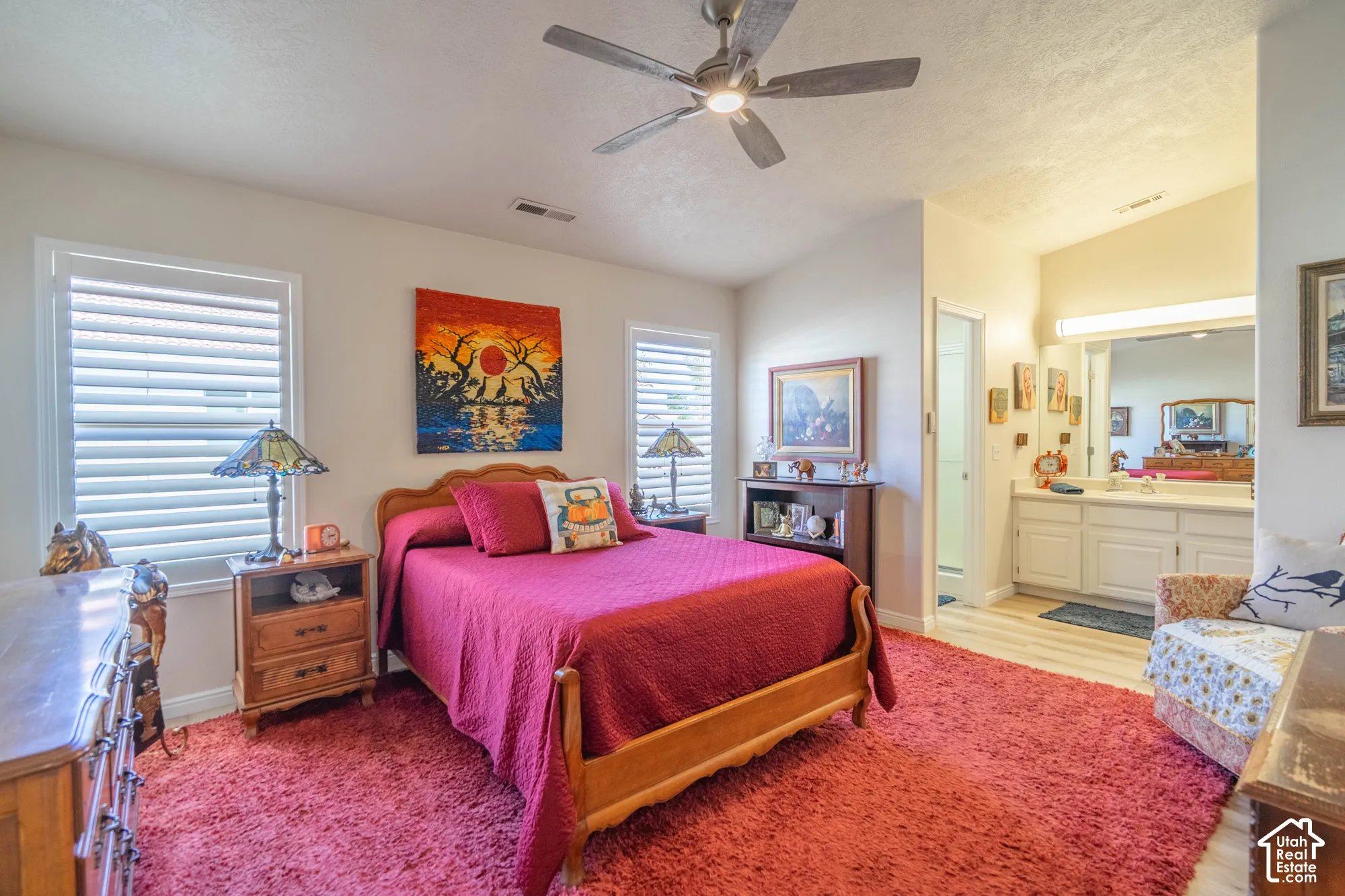 Recessed lighting, ceiling fan, white window blinds, white vanity with dual sinks, and light wood-finish flooring