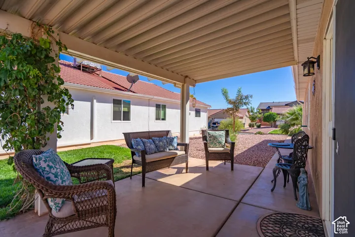 Covered patio featuring concrete flooring