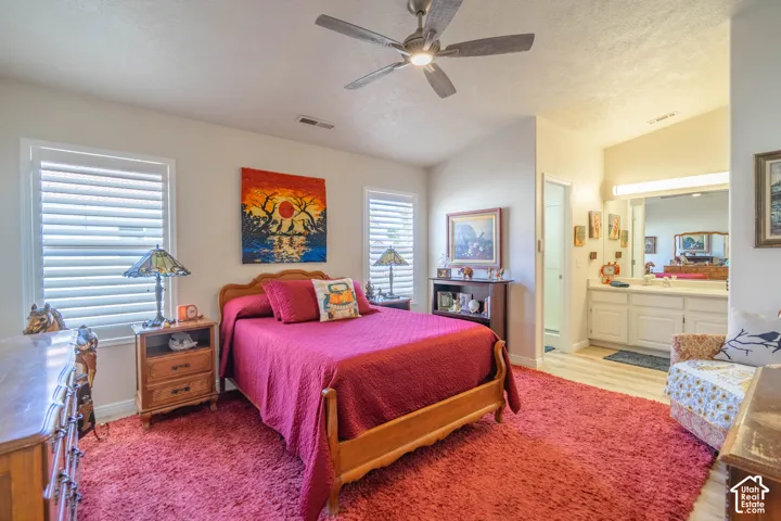 Recessed lighting, ceiling fan, white window blinds, white vanity with dual sinks, and light wood-finish flooring