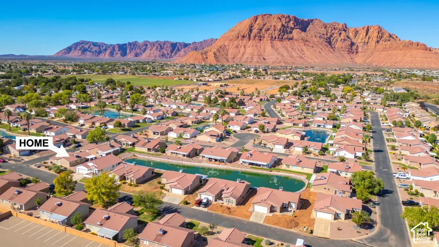 Community with extensive water features and mountain backdrop