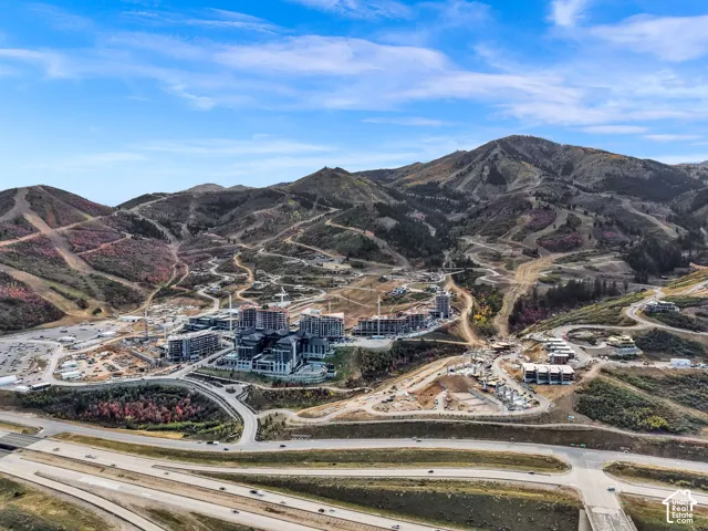 Expansive mountain landscape with developed infrastructure and multiple buildings