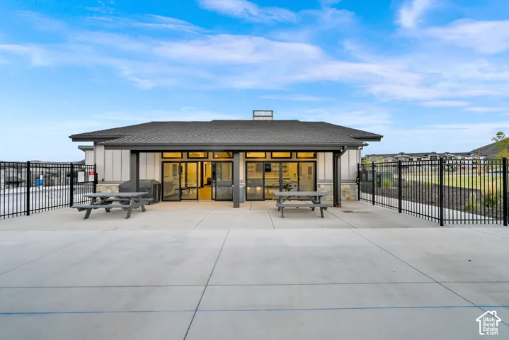 Modern pavilion-style structure with a distinctive curved roofline and clerestory window detail