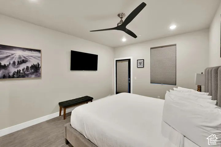 Recessed lighting, contemporary ceiling fan, and a neutral color palette