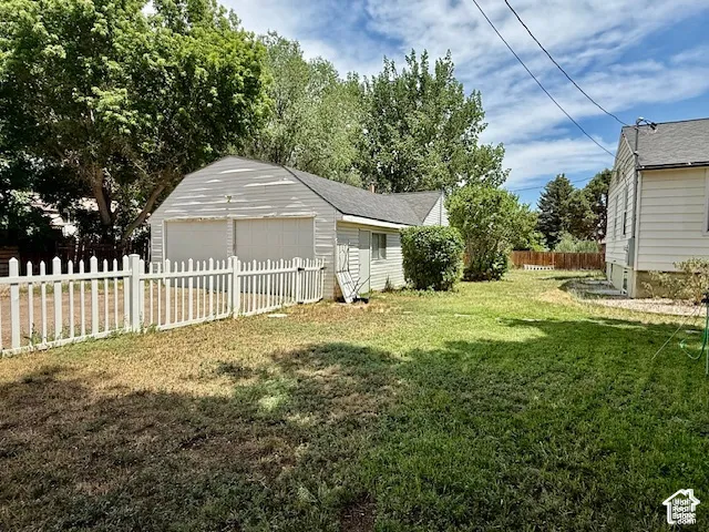 Charming cottage with white picket fencing and mature landscaping