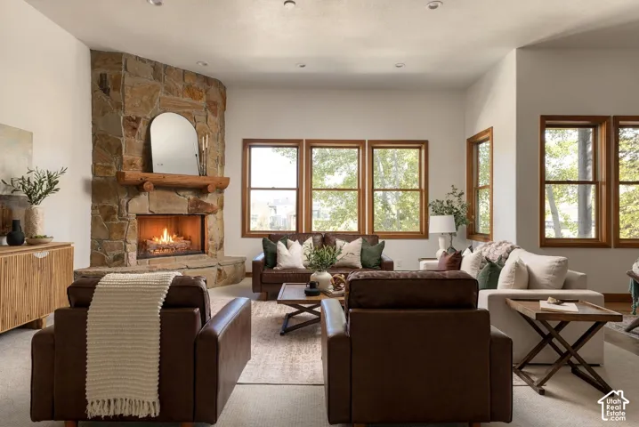 Stone-clad fireplace with a wood mantel