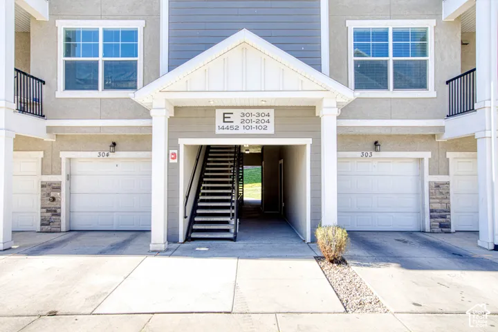 Multi-level exterior with stucco and siding finishes