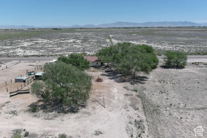 Property with expansive arid terrain and distant mountains