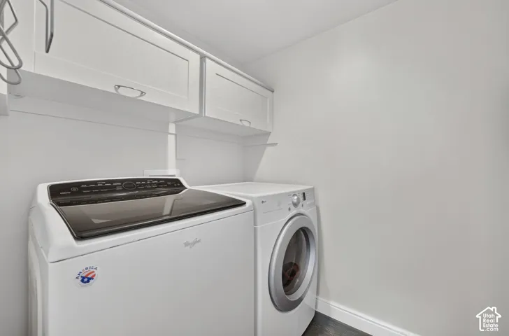 White shaker-style cabinetry with chrome pulls