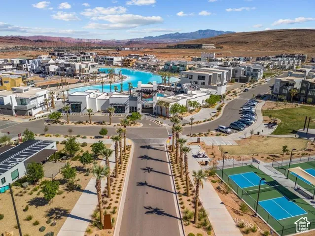 Community featuring a large recreational lagoon, multiple tennis courts, and contemporary residential architecture